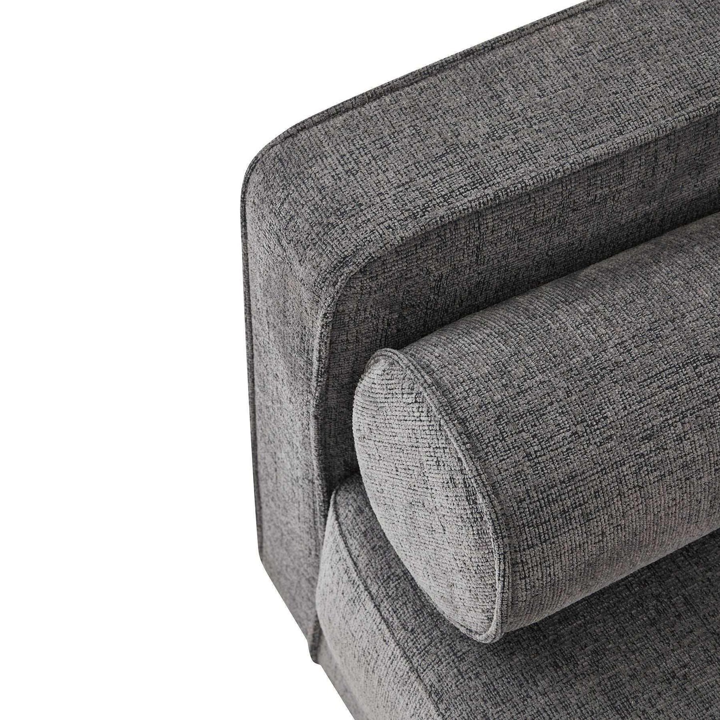 Close-up of textured grey fabric sofa armrest with matching cylindrical cushion