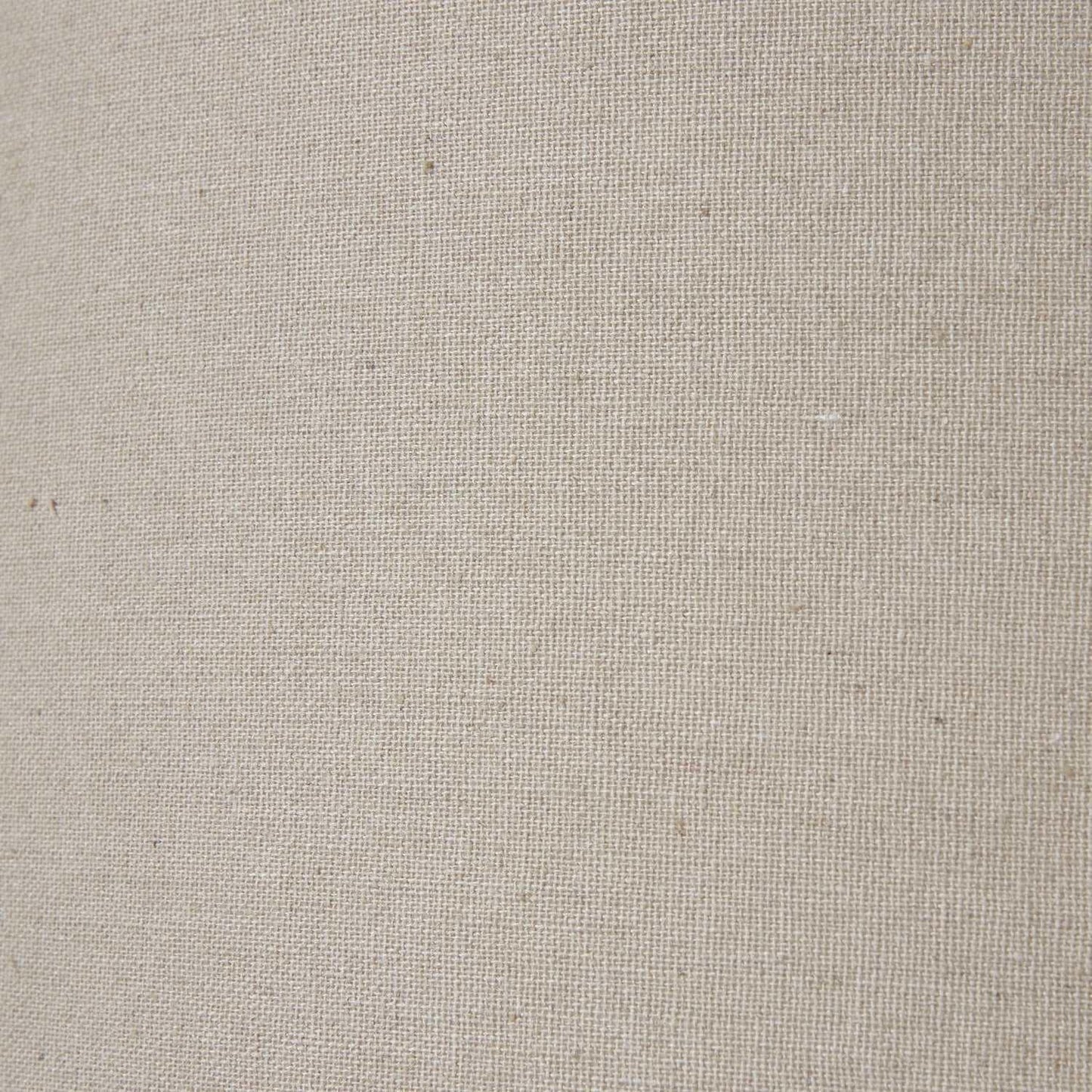 Close-up of natural beige linen upholstery fabric with visible woven texture