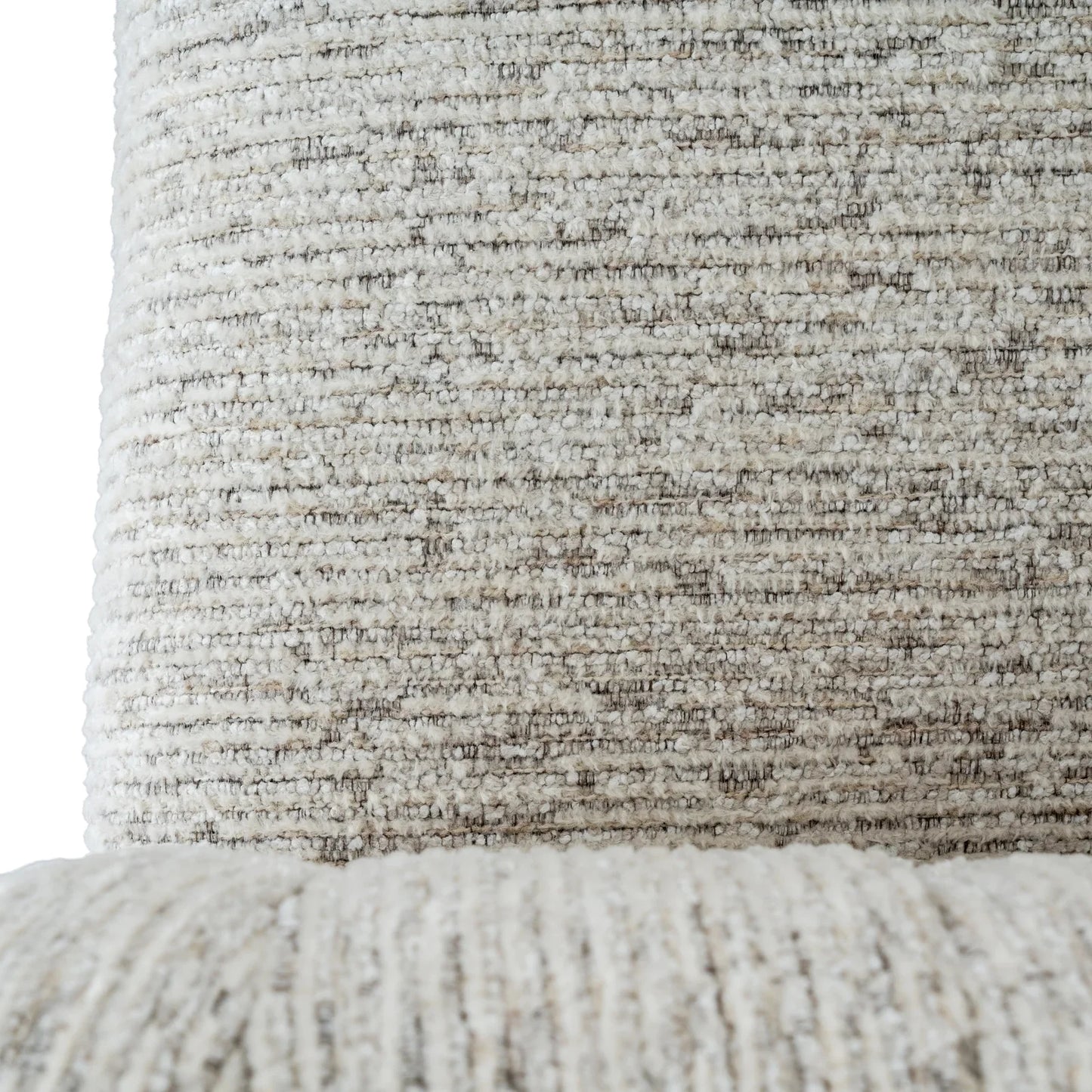 Close-up of textured cream boucle fabric upholstery on luxury designer furniture