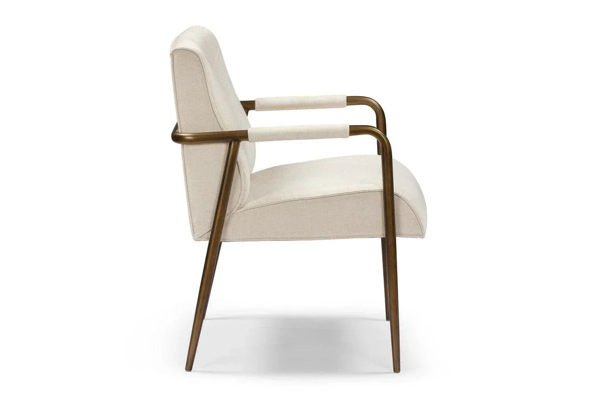 Modern cream upholstered armchair with bronze metal frame and minimalist design