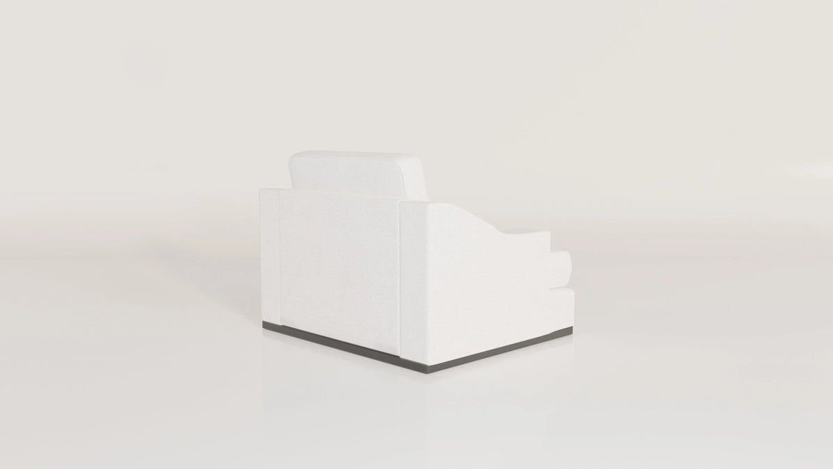 Modern white armchair with sloped armrest and black base on plain background