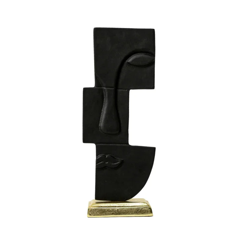 Abstract black face sculpture on gold base, modern handcrafted home decor accent