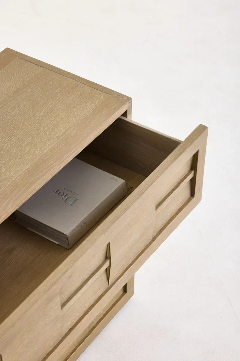 Open wooden drawer with book inside, showcasing modern luxury furniture design. Broadway Chest of Drawers