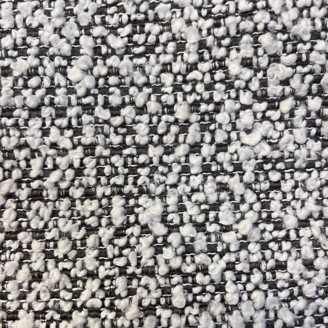 Ivory and taupe boucle fabric swatch with textured woven pattern, ideal for upholstery.