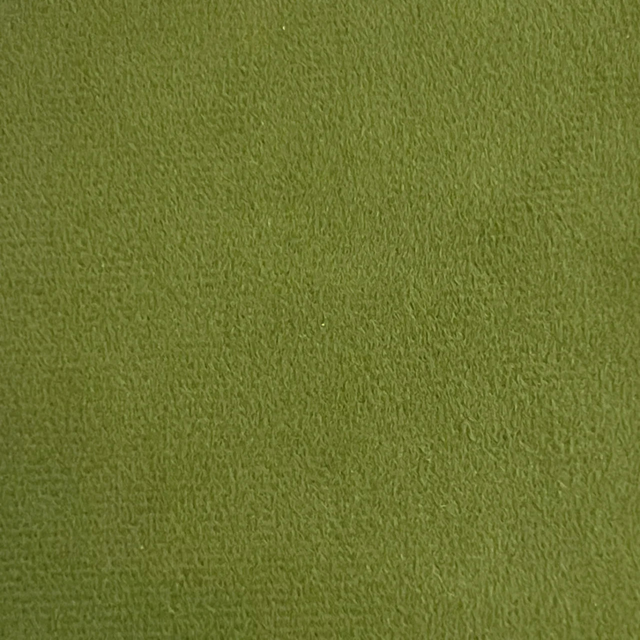 Olive green velvet fabric texture, close-up upholstery material sample